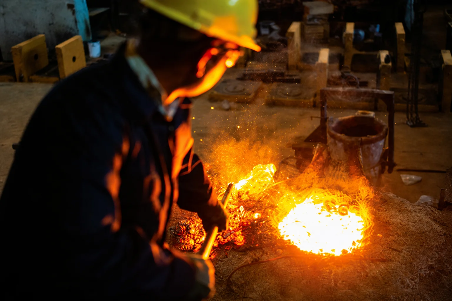 Foundry specialist working with molten metal